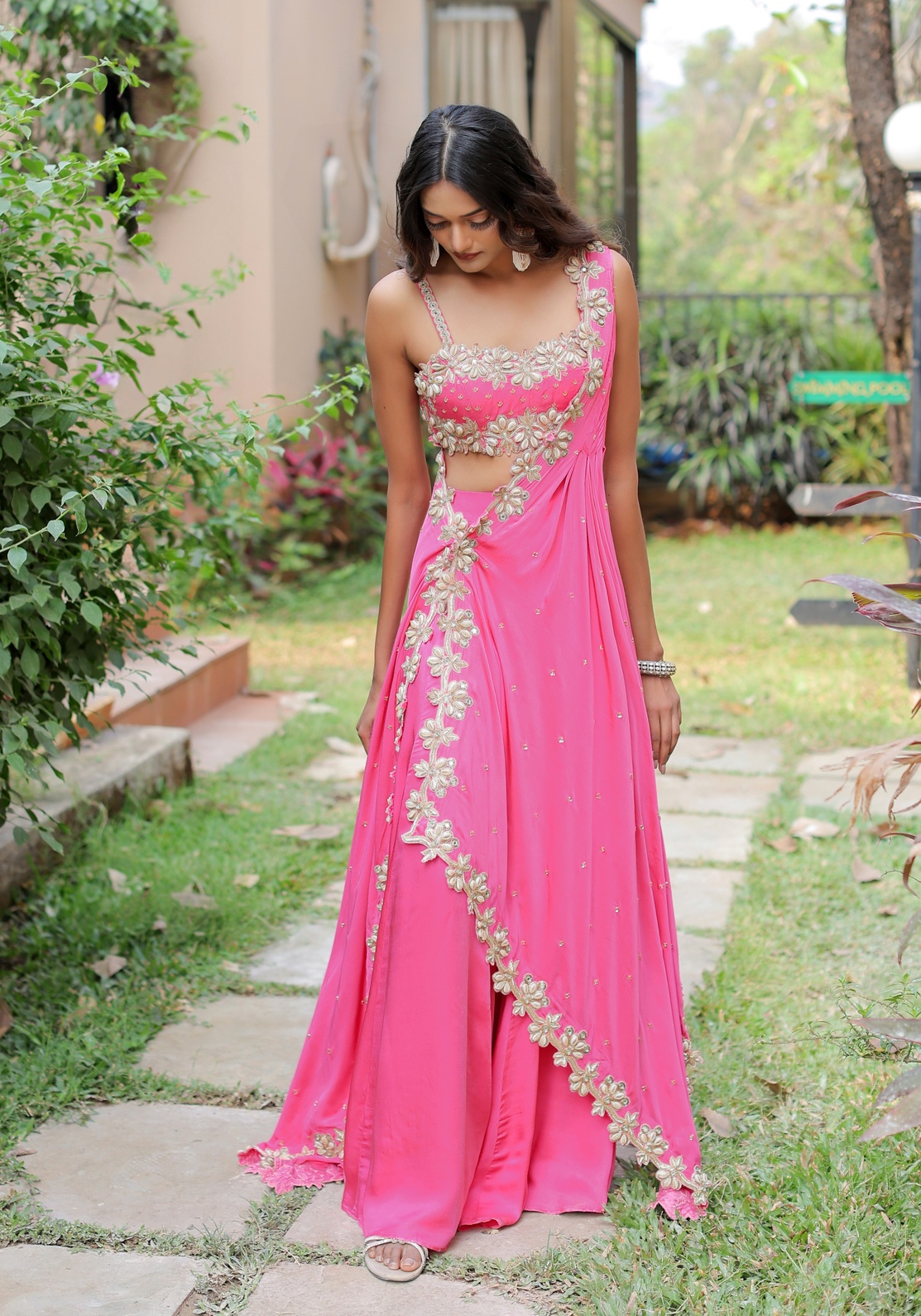 A model showcasing Pink Mirror And Cowrie Embroidered Cape Set by Foram Patel from Foram Patel's collection