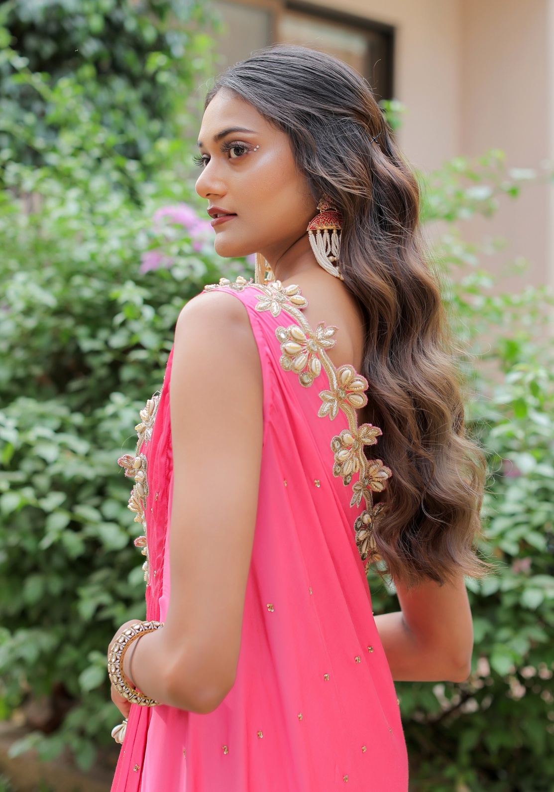 A model showcasing Pink Mirror And Cowrie Embroidered Cape Set by Foram Patel from Foram Patel's collection