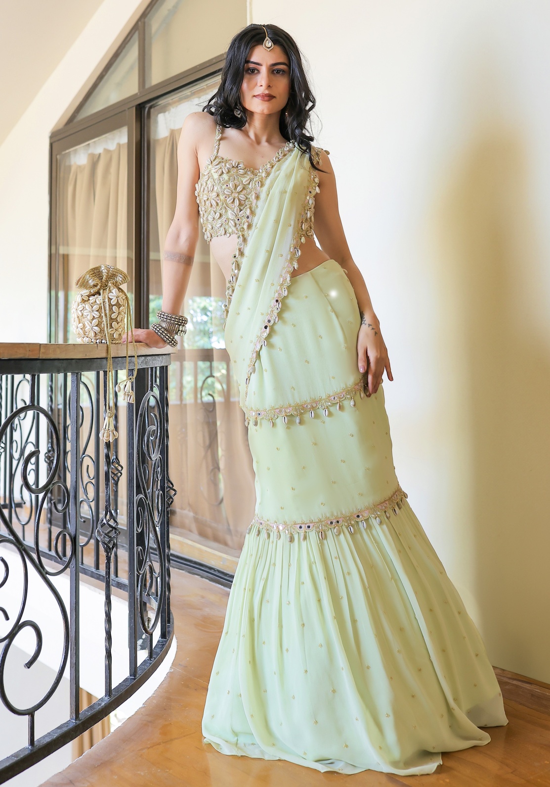 A model showcasing Mint Green Embroidered Mumtaz Saree Set by Foram Patel from Foram Patel's collection
