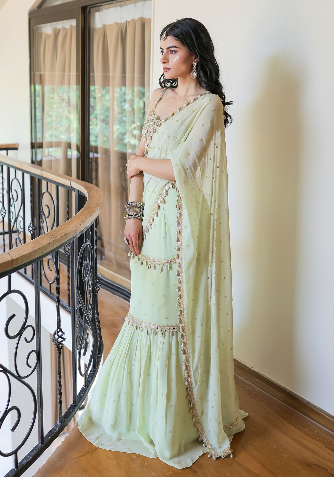 A model showcasing Mint Green Embroidered Mumtaz Saree Set by Foram Patel from Foram Patel's collection
