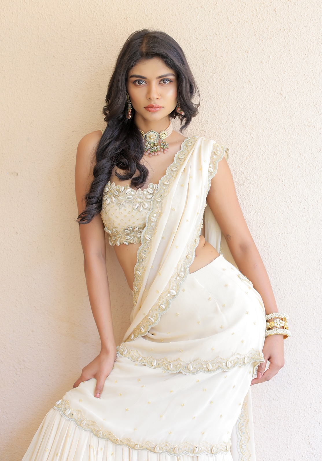 A model showcasing Cream Embroidered Mumtaz Saree Set by Foram Patel from Foram Patel's collection
