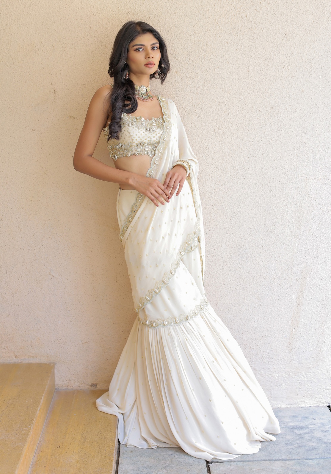 A model showcasing Cream Embroidered Mumtaz Saree Set by Foram Patel from Foram Patel's collection