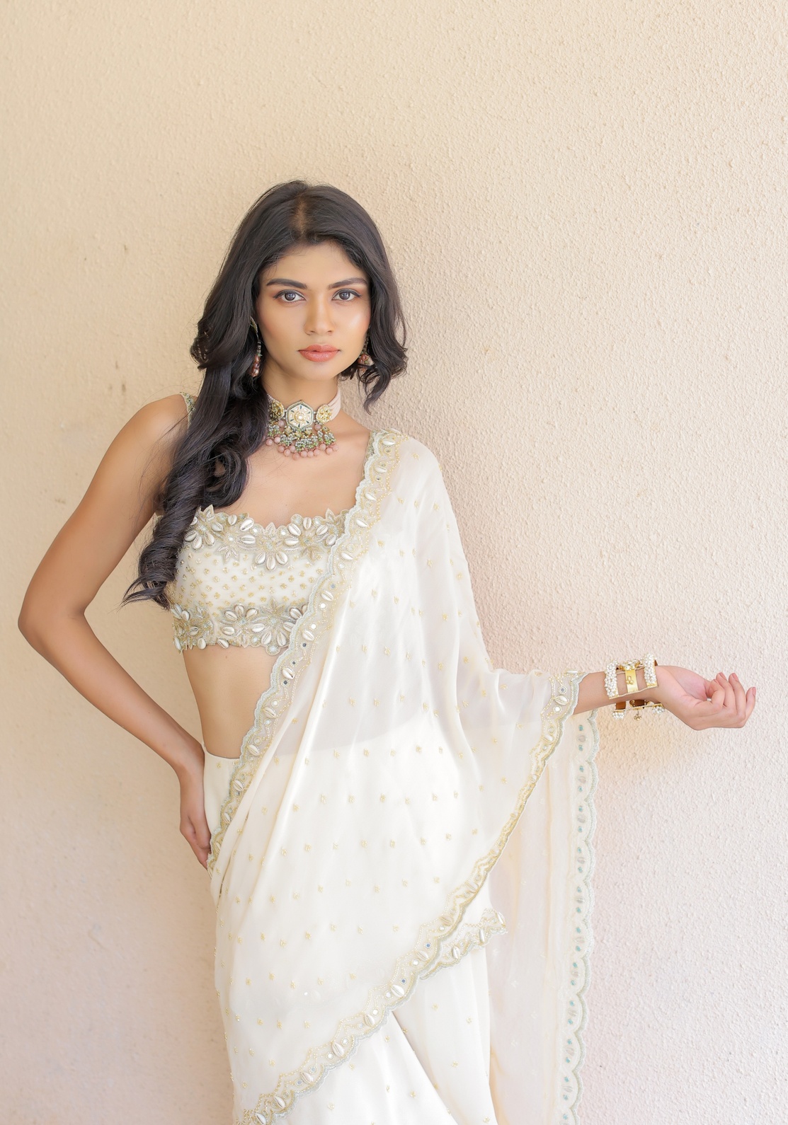 A model showcasing Cream Embroidered Mumtaz Saree Set by Foram Patel from Foram Patel's collection
