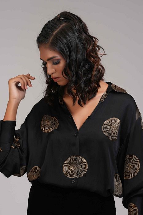 A model showcasing Black Formal Satin Shirt In Loose Fit by Shruti S Label from Shruti S Label's collection