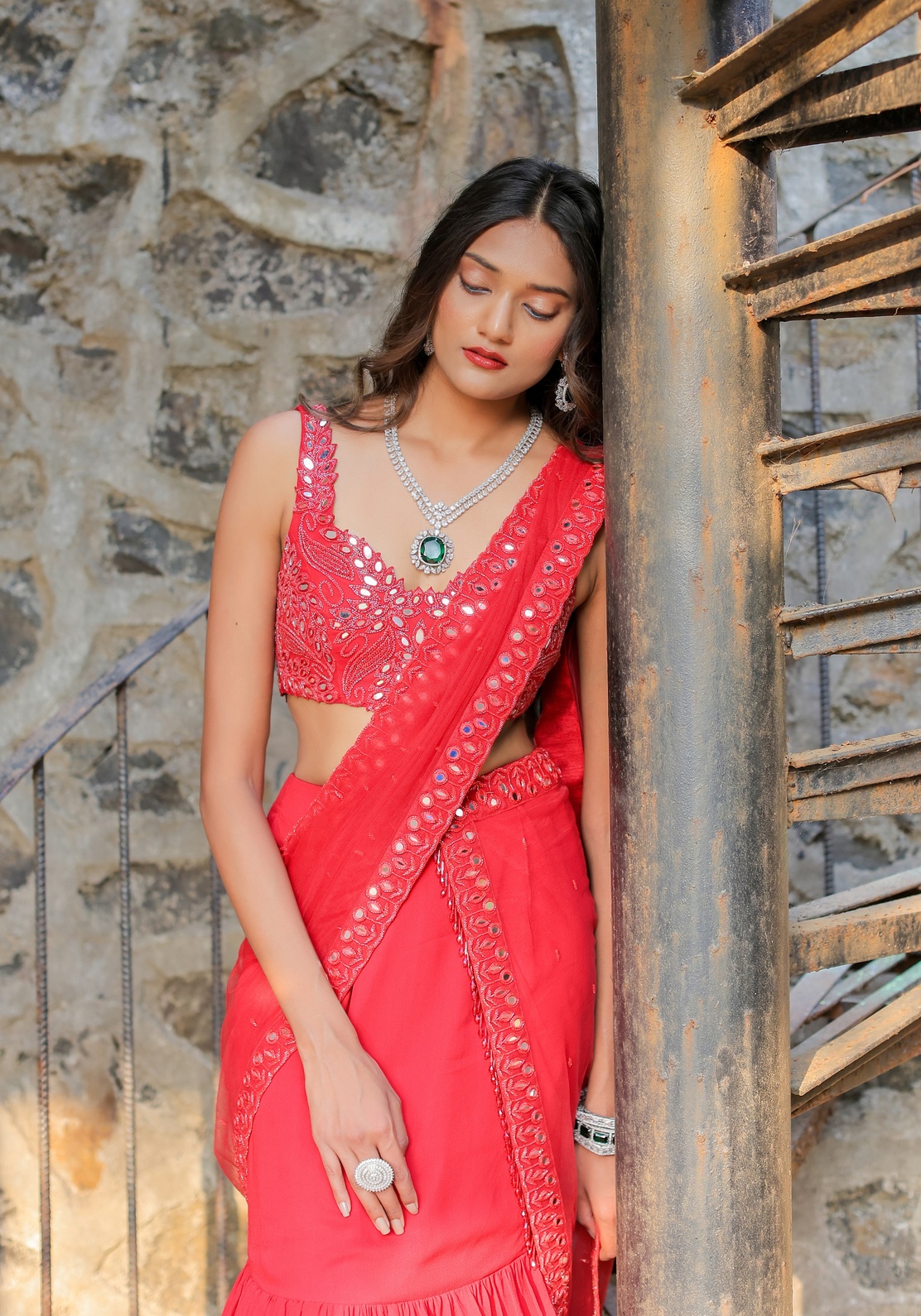 A model showcasing Red Mirror Embroidered Ruffle Saree Set by Foram Patel from Foram Patel's collection