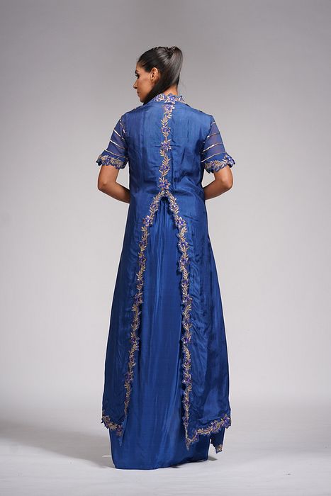 A model showcasing Dhoti Skirt With Croptop And Cape In Blue by Shruti S Label from Shruti S Label's collection