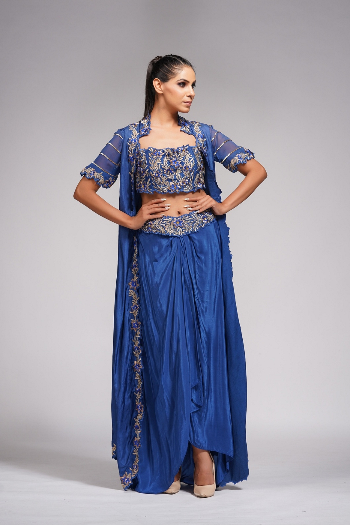 A model showcasing Dhoti Skirt With Croptop And Cape In Blue Feature image by Shruti S Label from Shruti S Label's collection