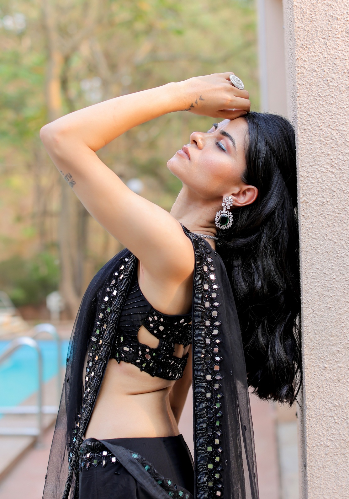 A model showcasing Black Mirror Embroidered Ruffle Saree Set by Foram Patel from Foram Patel's collection