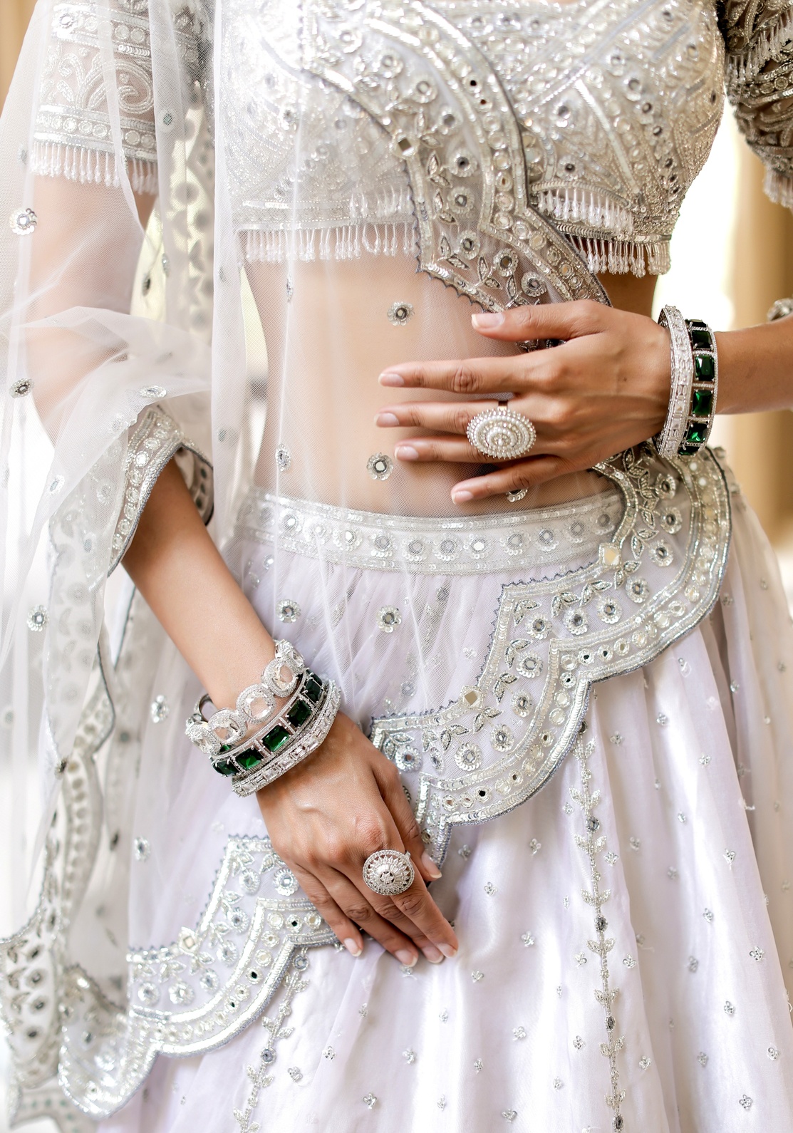 A model showcasing Grey With Silver Mirror Embroidered Organza Lehenga by Foram Patel from Foram Patel's collection