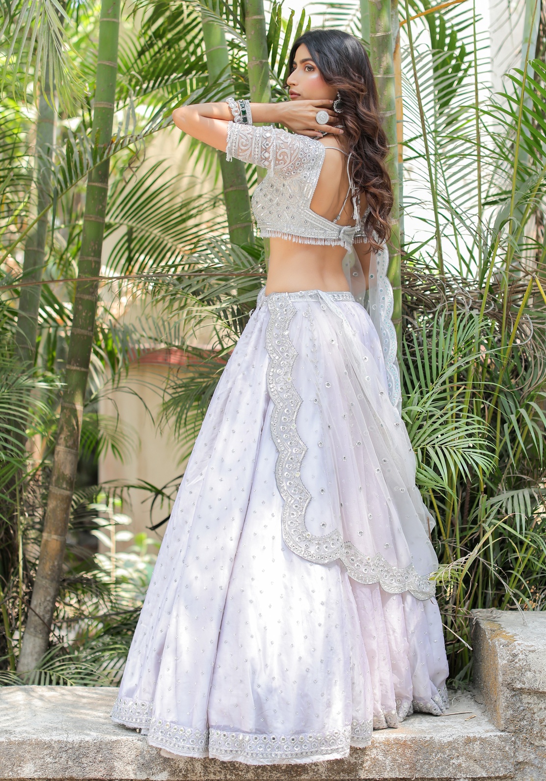 A model showcasing Grey With Silver Mirror Embroidered Organza Lehenga by Foram Patel from Foram Patel's collection