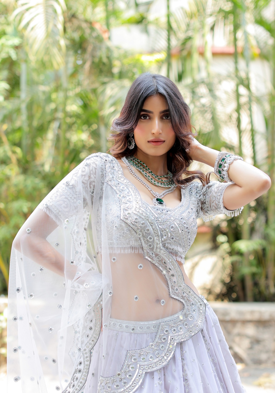 A model showcasing Grey With Silver Mirror Embroidered Organza Lehenga by Foram Patel from Foram Patel's collection