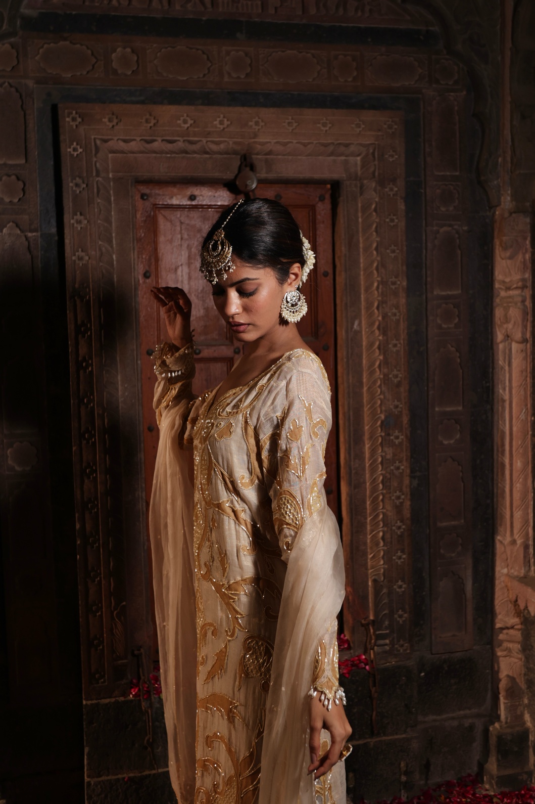 A model showcasing Ivory And Golden Kurta With Palazzo by Farha Syed from Farha Syed's collection