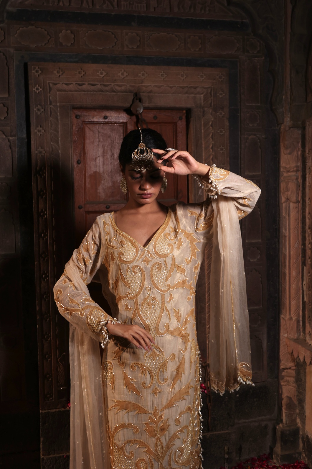 A model showcasing Ivory And Golden Kurta With Palazzo by Farha Syed from Farha Syed's collection