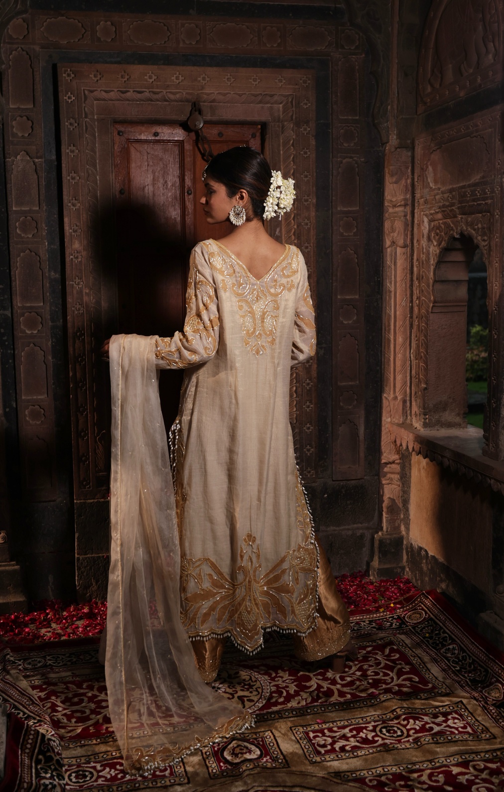 A model showcasing Ivory And Golden Kurta With Palazzo by Farha Syed from Farha Syed's collection