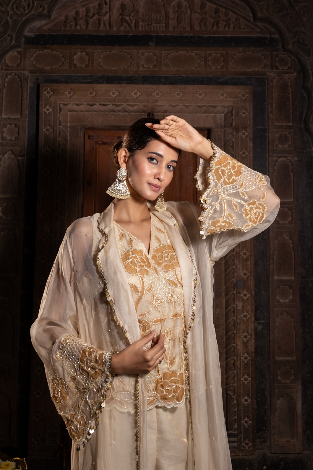 A model showcasing Ivory And Golden 3 Piece Jacket Set by Farha Syed from Farha Syed's collection