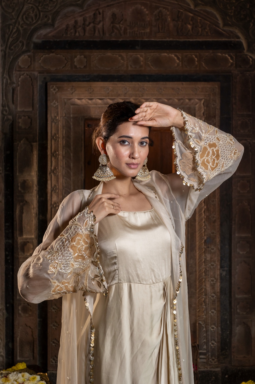 A model showcasing Ivory And Golden Jacket And Drape Gown by Farha Syed from Farha Syed's collection