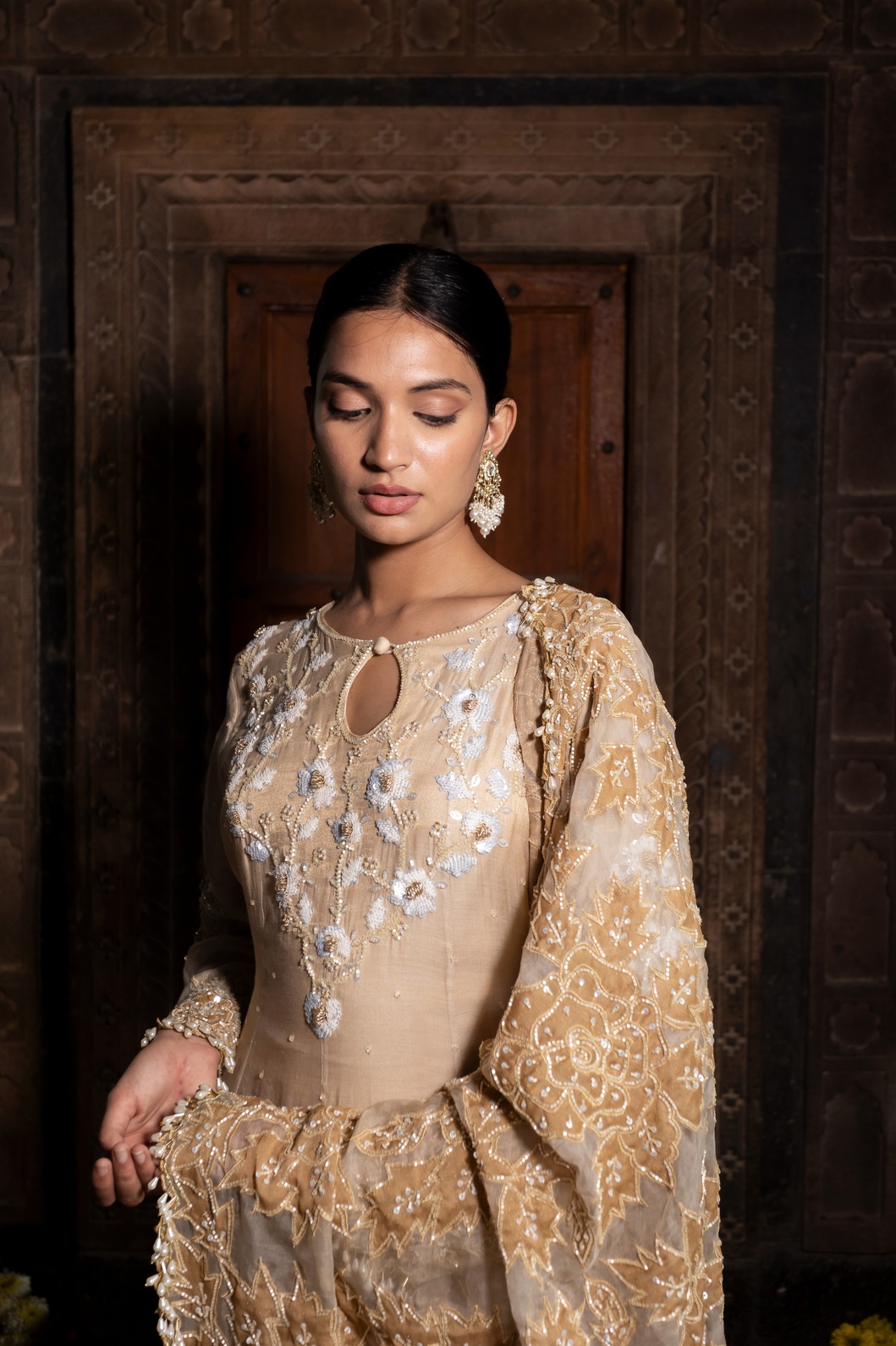 A model showcasing Ivory And Golden Anarkali Palazzo Set by Farha Syed from Farha Syed's collection
