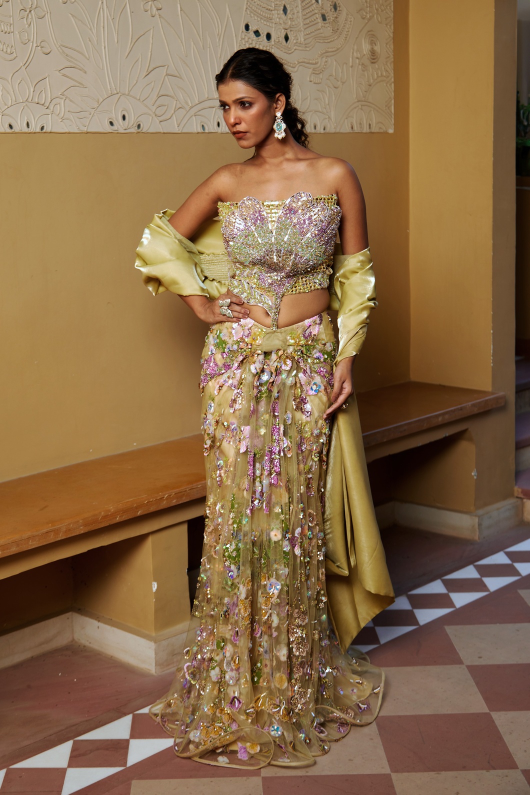 A model showcasing Elegant Gold 3piece Predraped Saree Set With Floral Embroidery by Moledro from Moledro's collection