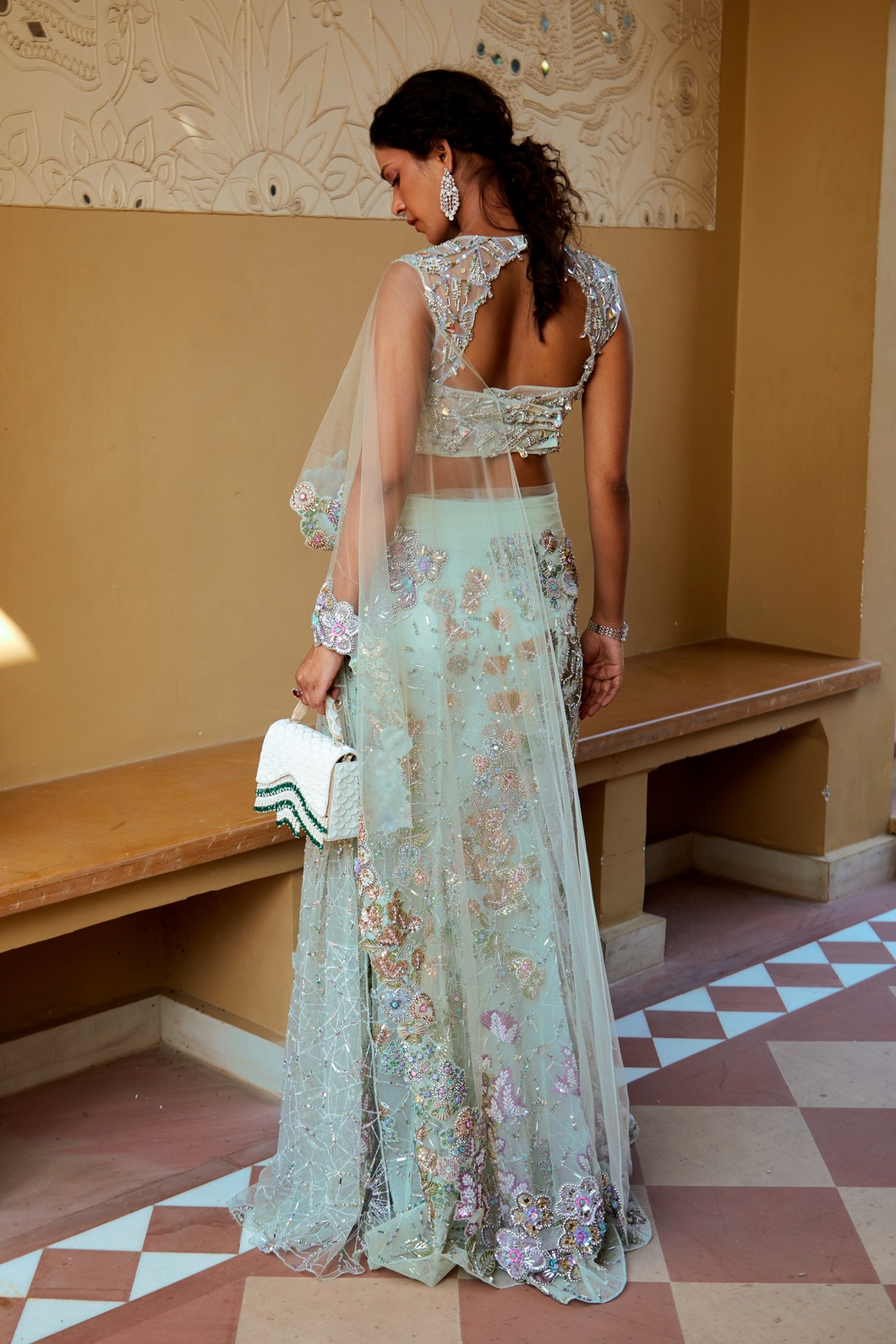 A model showcasing Elegant Aqua Soiree Look Sparkle With Sequins Crystals by Moledro from Moledro's collection
