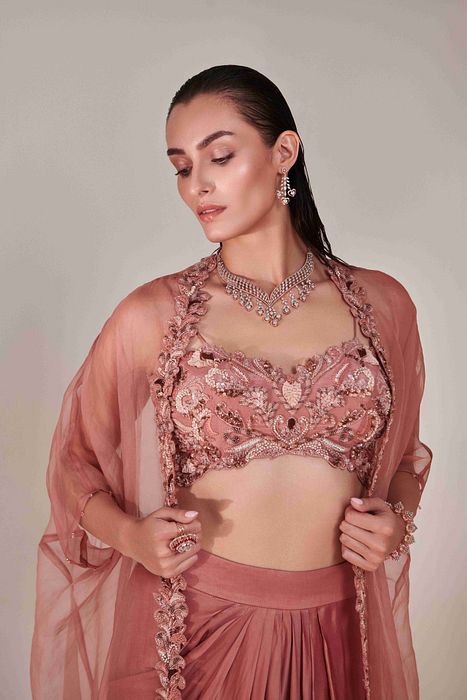 A model showcasing Salmon Pink Pure Organza Cape Set by One Knot One from One Knot One's collection