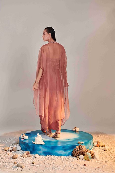 A model showcasing Salmon Pink Pure Organza Cape Set by One Knot One from One Knot One's collection
