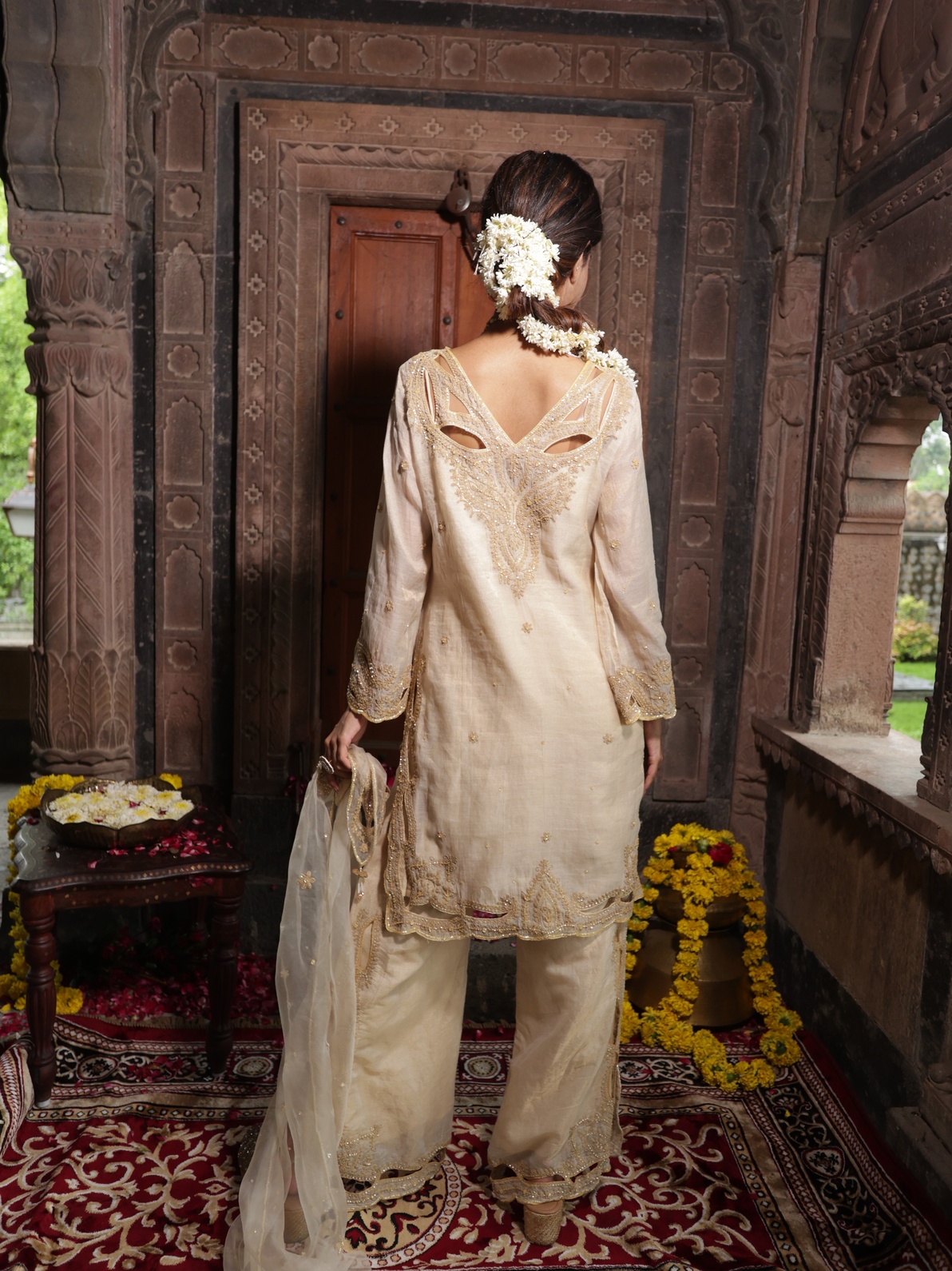 A model showcasing Beige Tissue Kurta Set With Organza Dupatta by Farha Syed from Farha Syed's collection