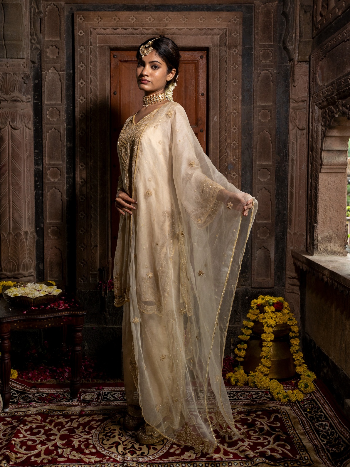 A model showcasing Beige Tissue Kurta Set With Organza Dupatta by Farha Syed from Farha Syed's collection