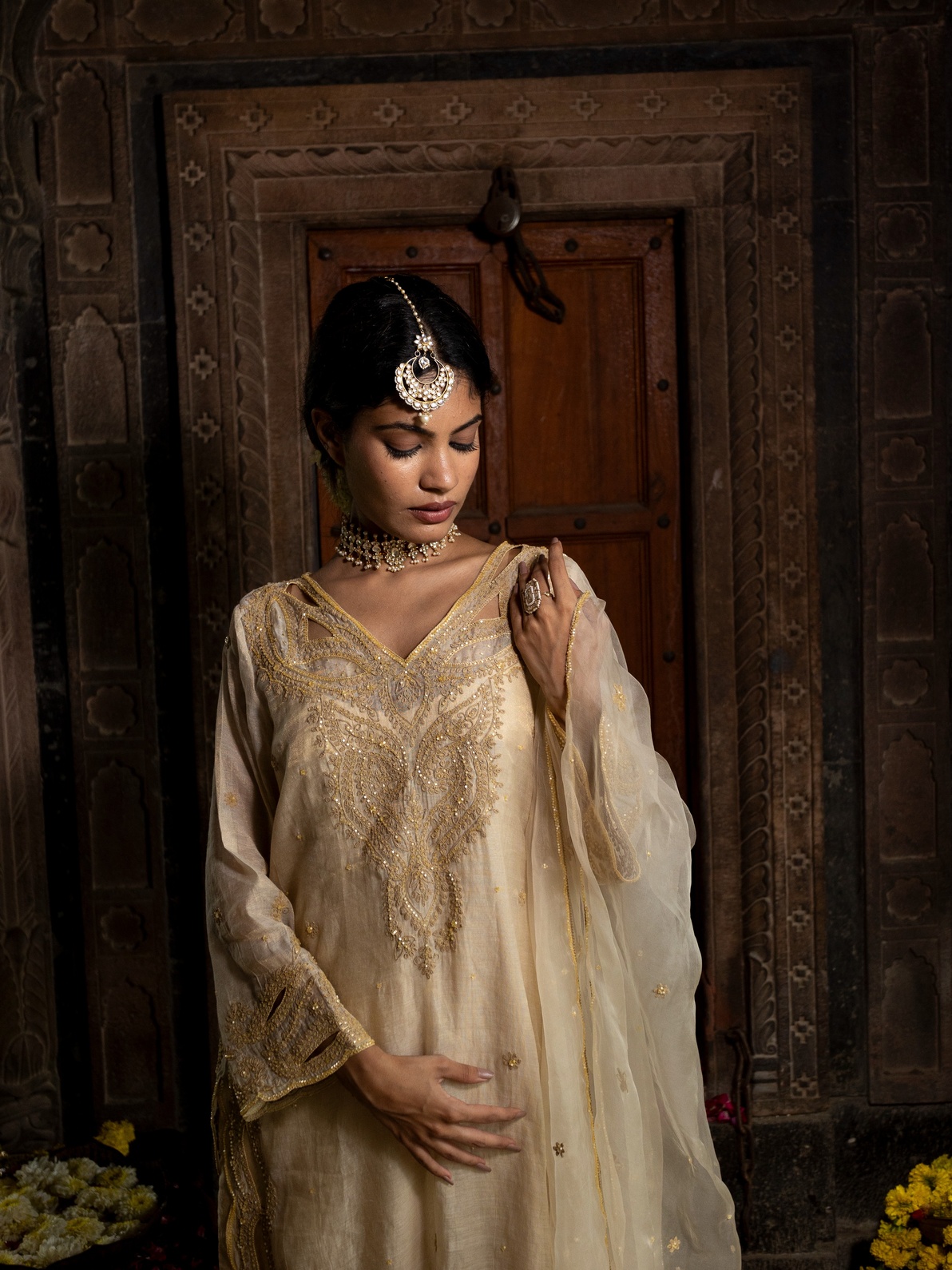 A model showcasing Beige Tissue Kurta Set With Organza Dupatta by Farha Syed from Farha Syed's collection