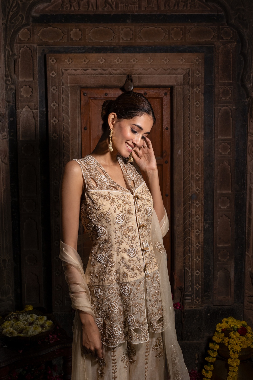 A model showcasing Beige Hand Embroidered Kurta With Sharara Set by Farha Syed from Farha Syed's collection