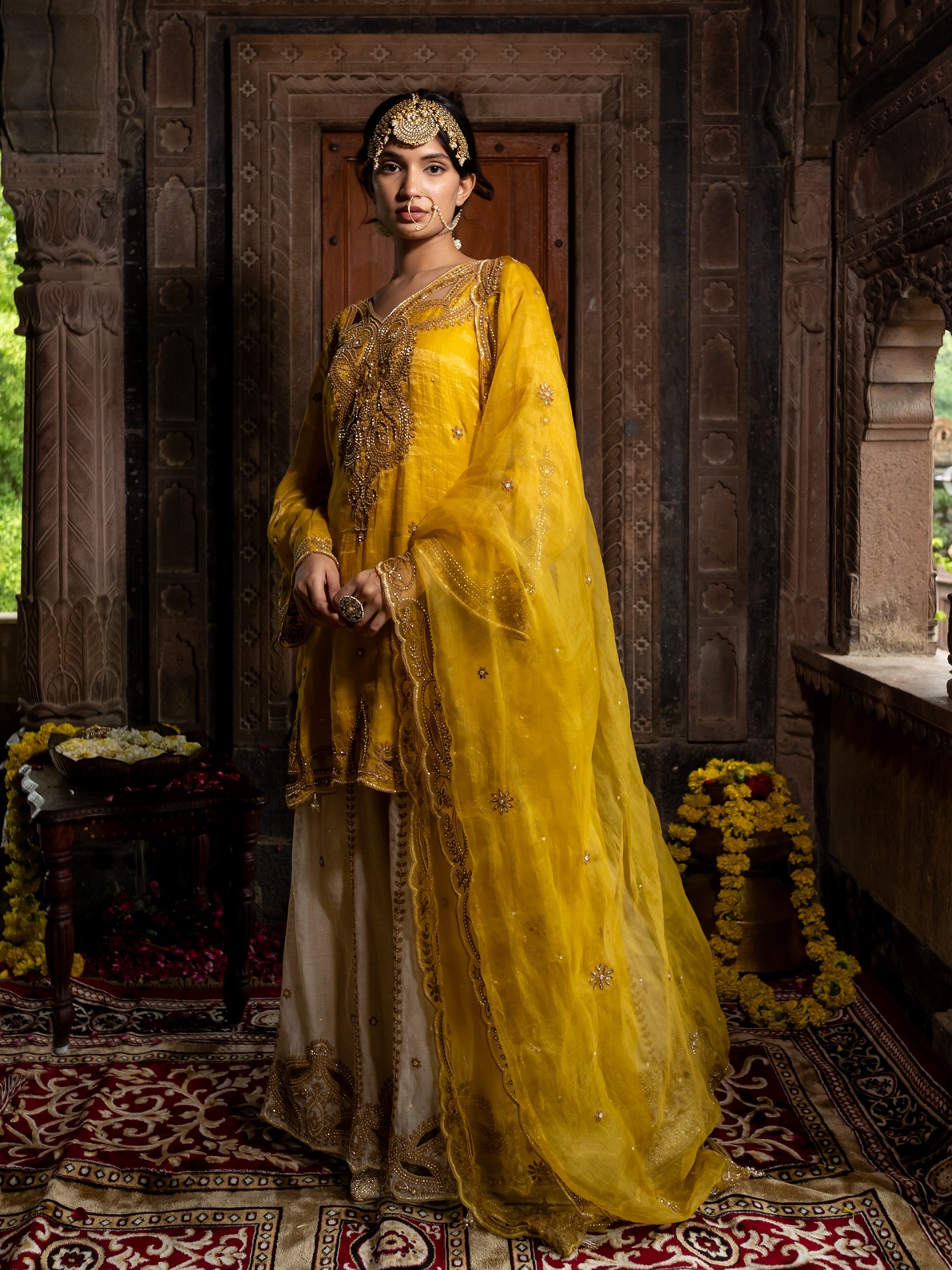 A model showcasing Yellow Chanderi Silk Kurta With Beige Sharara Set by Farha Syed from Farha Syed's collection