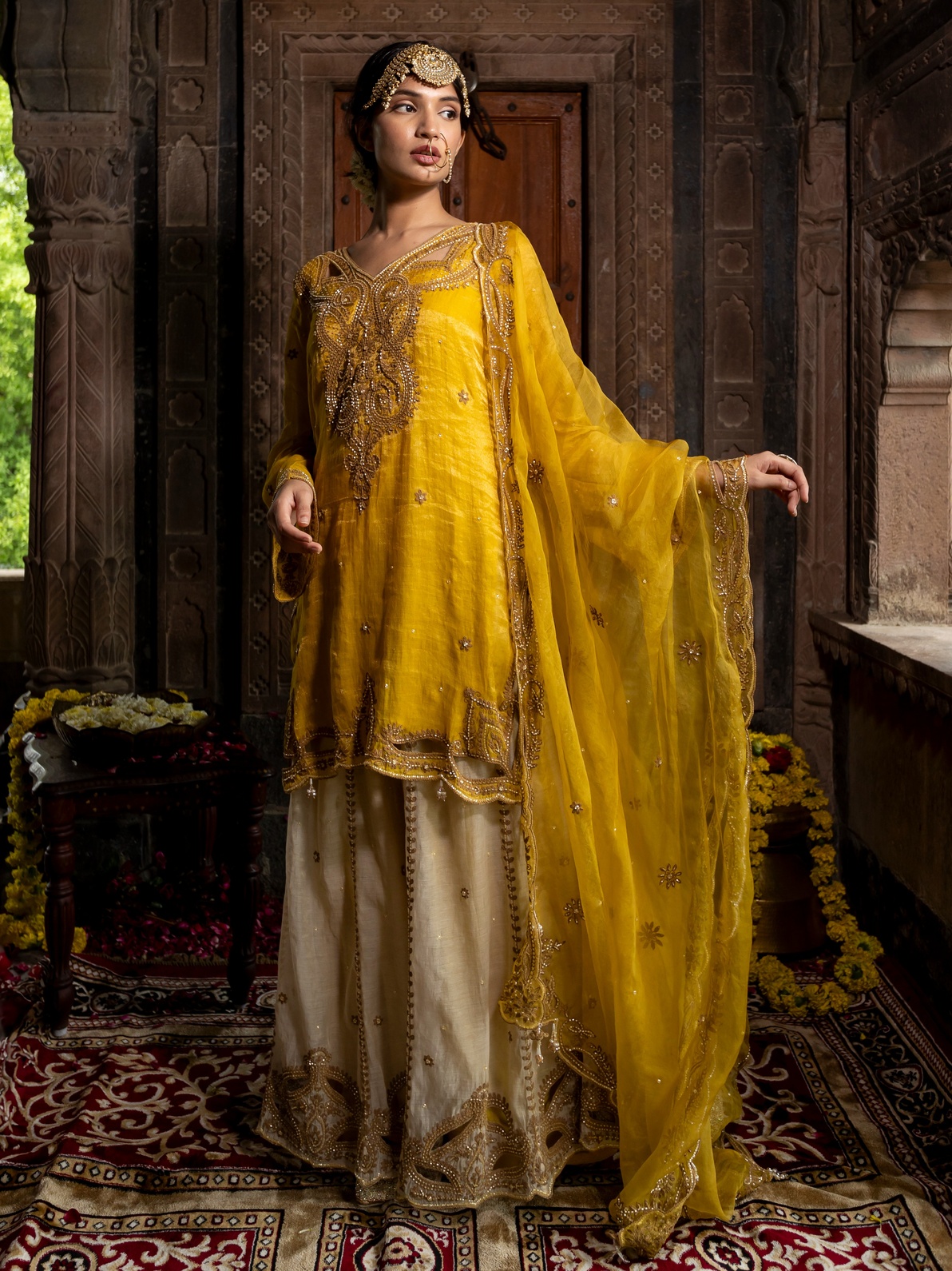 A model showcasing Yellow Chanderi Silk Kurta With Beige Sharara Set by Farha Syed from Farha Syed's collection