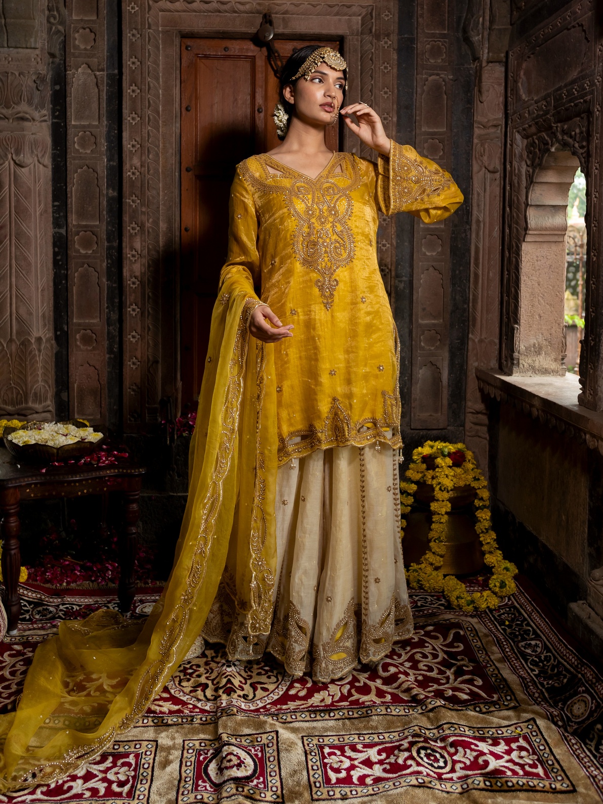 A model showcasing Yellow Chanderi Silk Kurta With Beige Sharara Set by Farha Syed from Farha Syed's collection