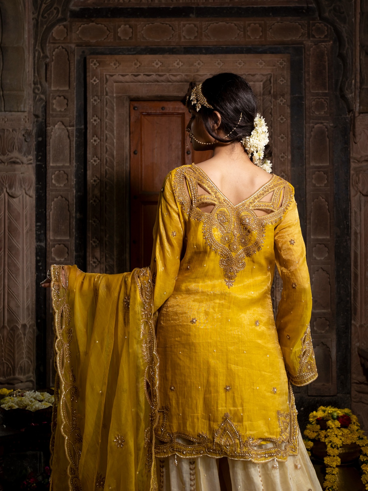 A model showcasing Yellow Chanderi Silk Kurta With Beige Sharara Set by Farha Syed from Farha Syed's collection