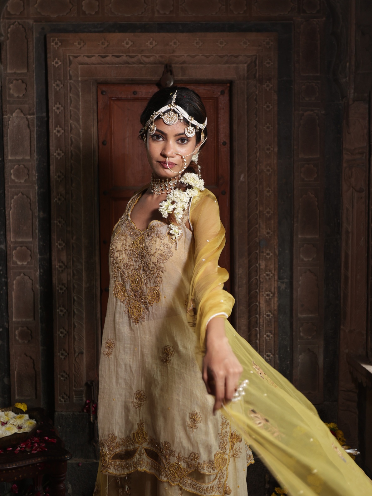 A model showcasing Beige Kurta And Sharara Set With Yellow Dupatta by Farha Syed from Farha Syed's collection