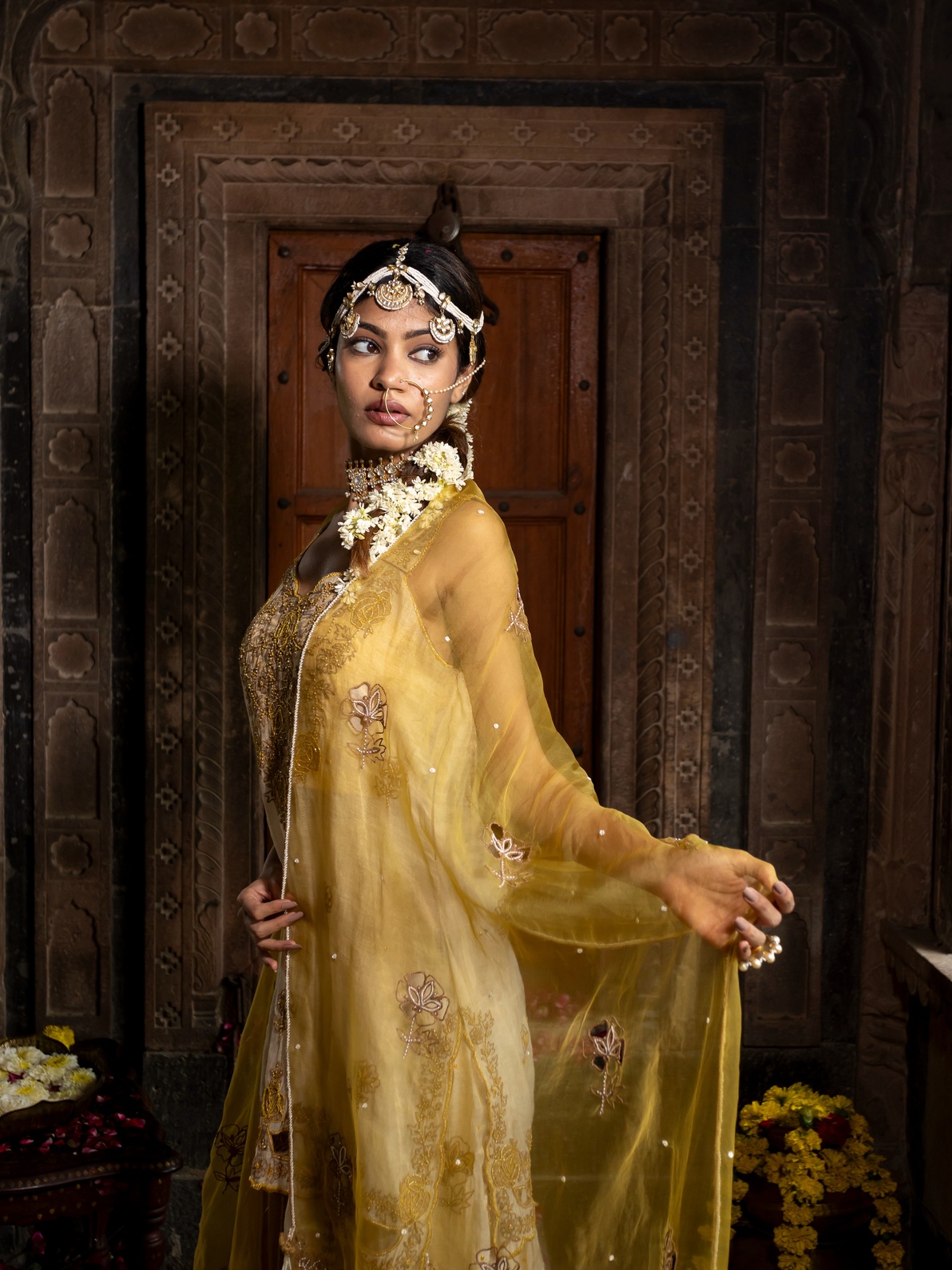 A model showcasing Beige Kurta And Sharara Set With Yellow Dupatta by Farha Syed from Farha Syed's collection