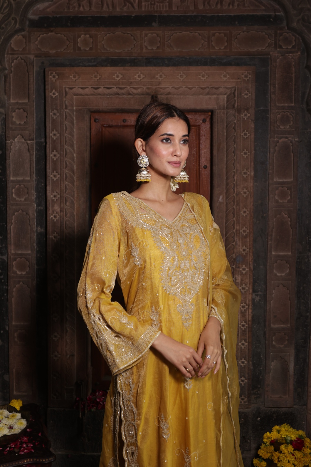 A model showcasing Yellow Hand Embroidered Kurta Set With Pure Dupatta by Farha Syed from Farha Syed's collection