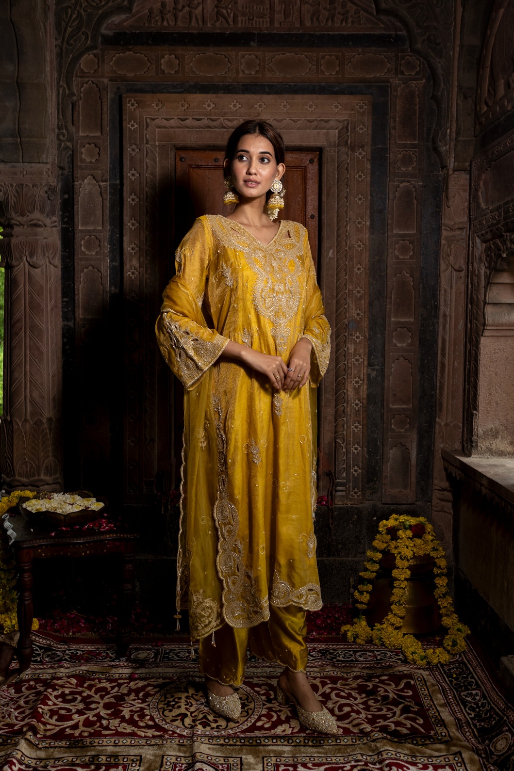 A model showcasing Yellow Hand Embroidered Kurta Set With Pure Dupatta by Farha Syed from Farha Syed's collection