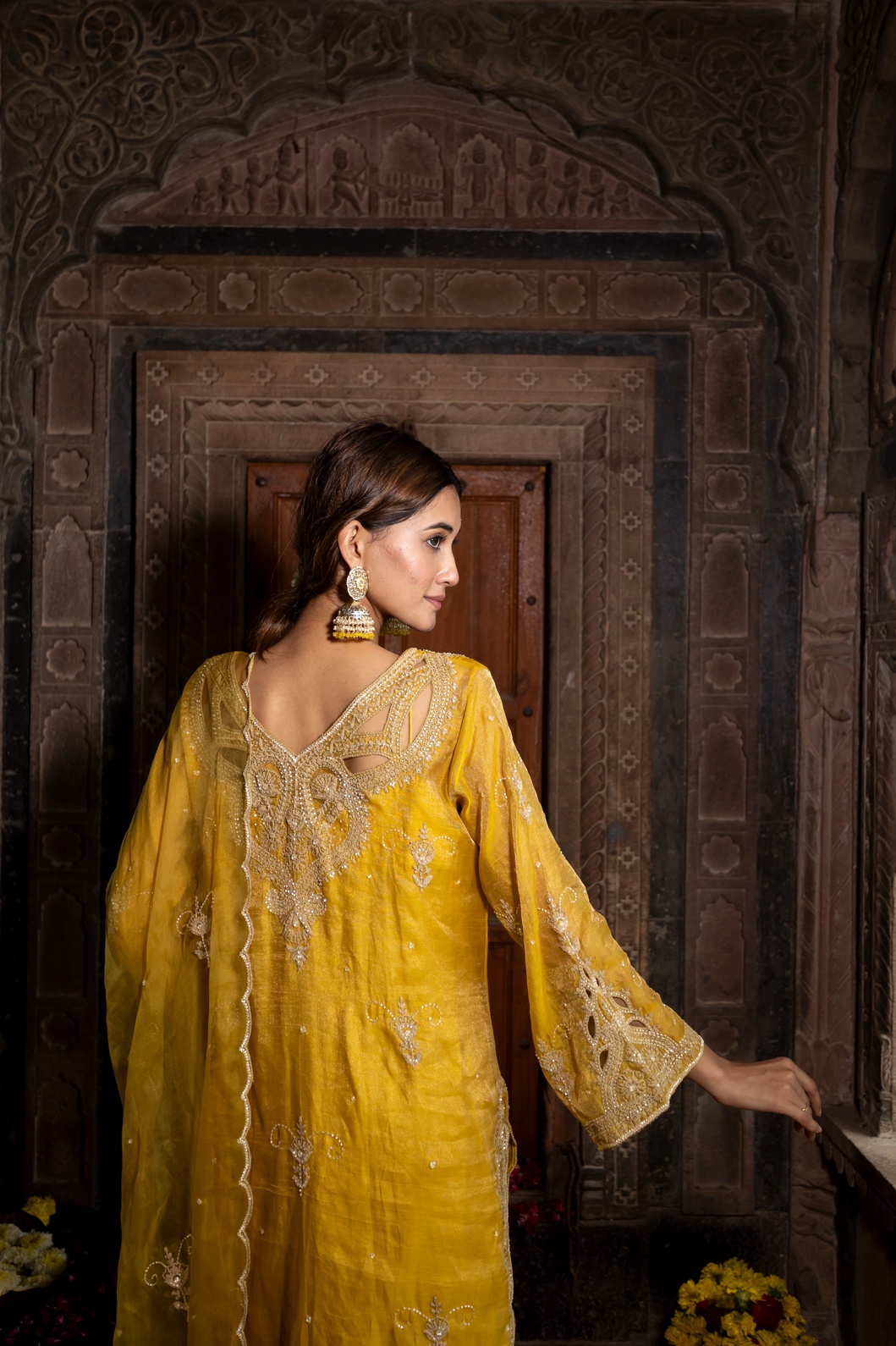 A model showcasing Yellow Hand Embroidered Kurta Set With Pure Dupatta by Farha Syed from Farha Syed's collection