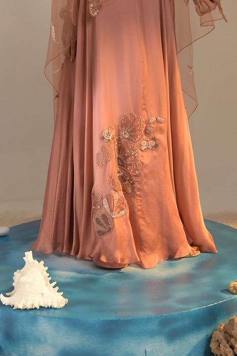 A model showcasing Salmon Pink Cutwork Blouse Applique Lehenga by One Knot One from One Knot One's collection