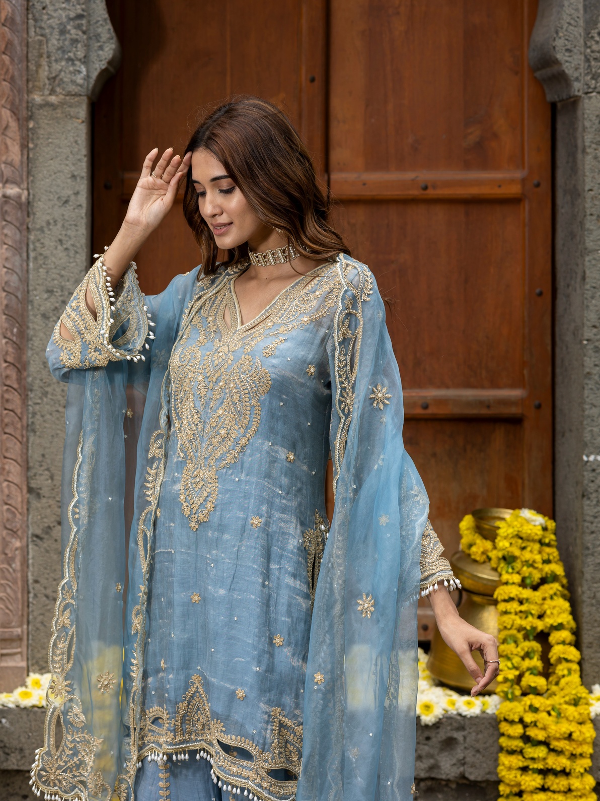 A model showcasing Blue Embroidered Sharara Set With Organza Dupatta by Farha Syed from Farha Syed's collection