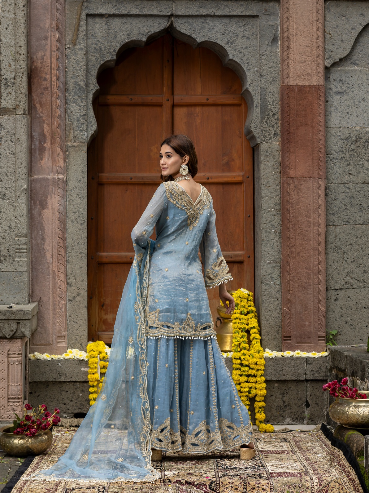 A model showcasing Blue Embroidered Sharara Set With Organza Dupatta by Farha Syed from Farha Syed's collection