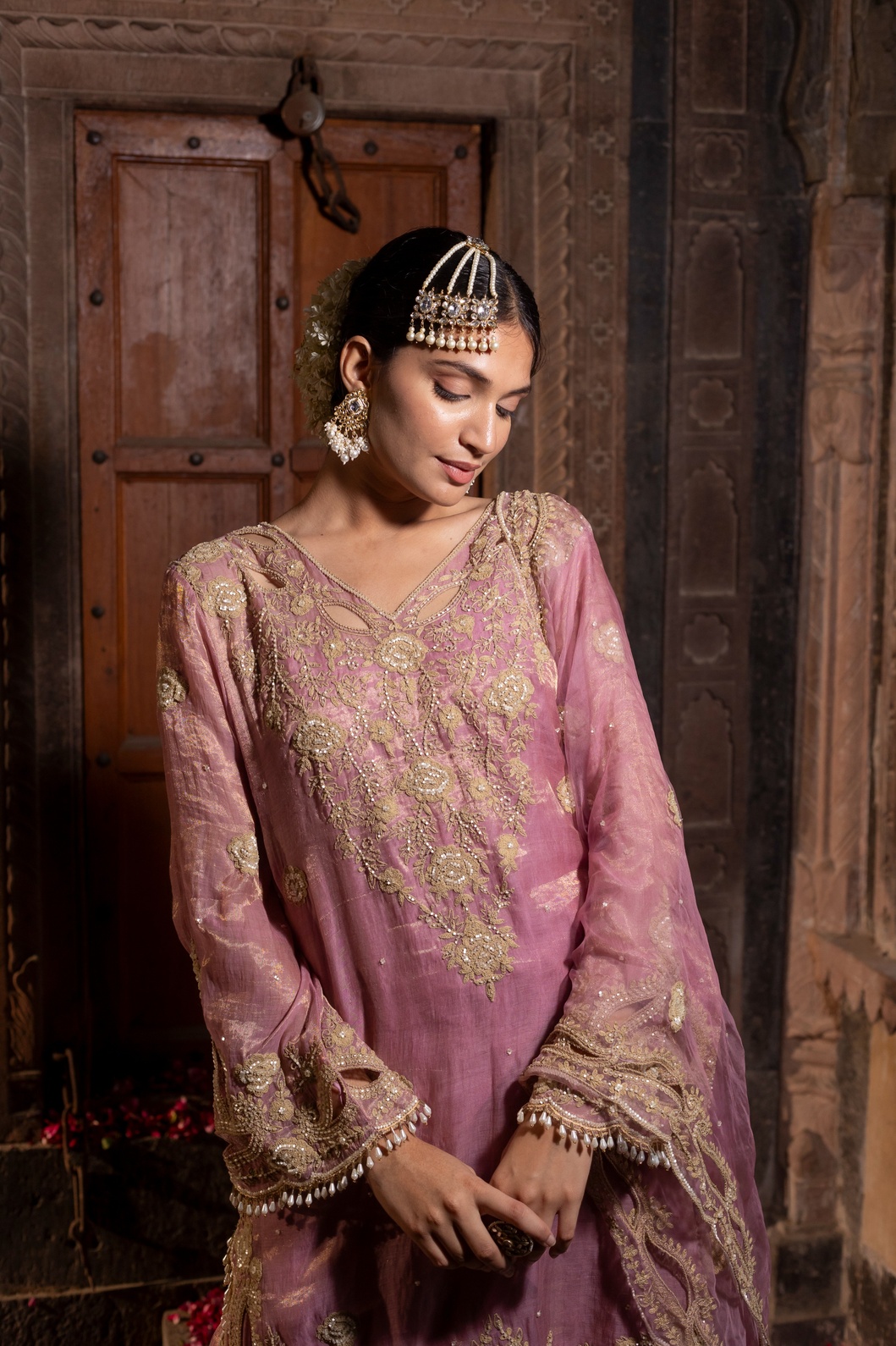 A model showcasing Hand Embroidered Kurta With Sharara Set by Farha Syed from Farha Syed's collection