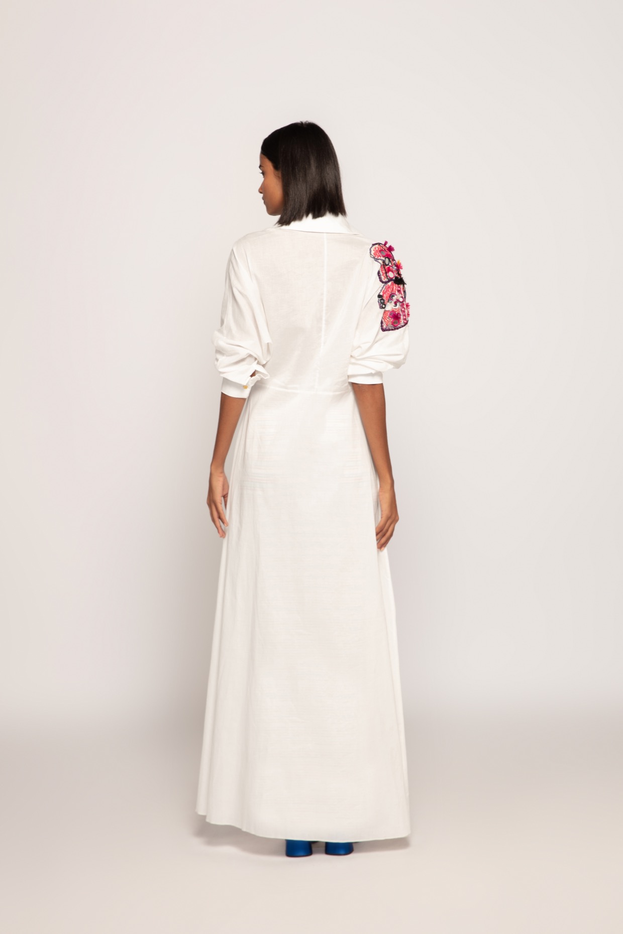 A model showcasing Hand Embroidered Maxi Length Shirt Dress by Saaksha And Kinni from Saaksha And Kinni's collection