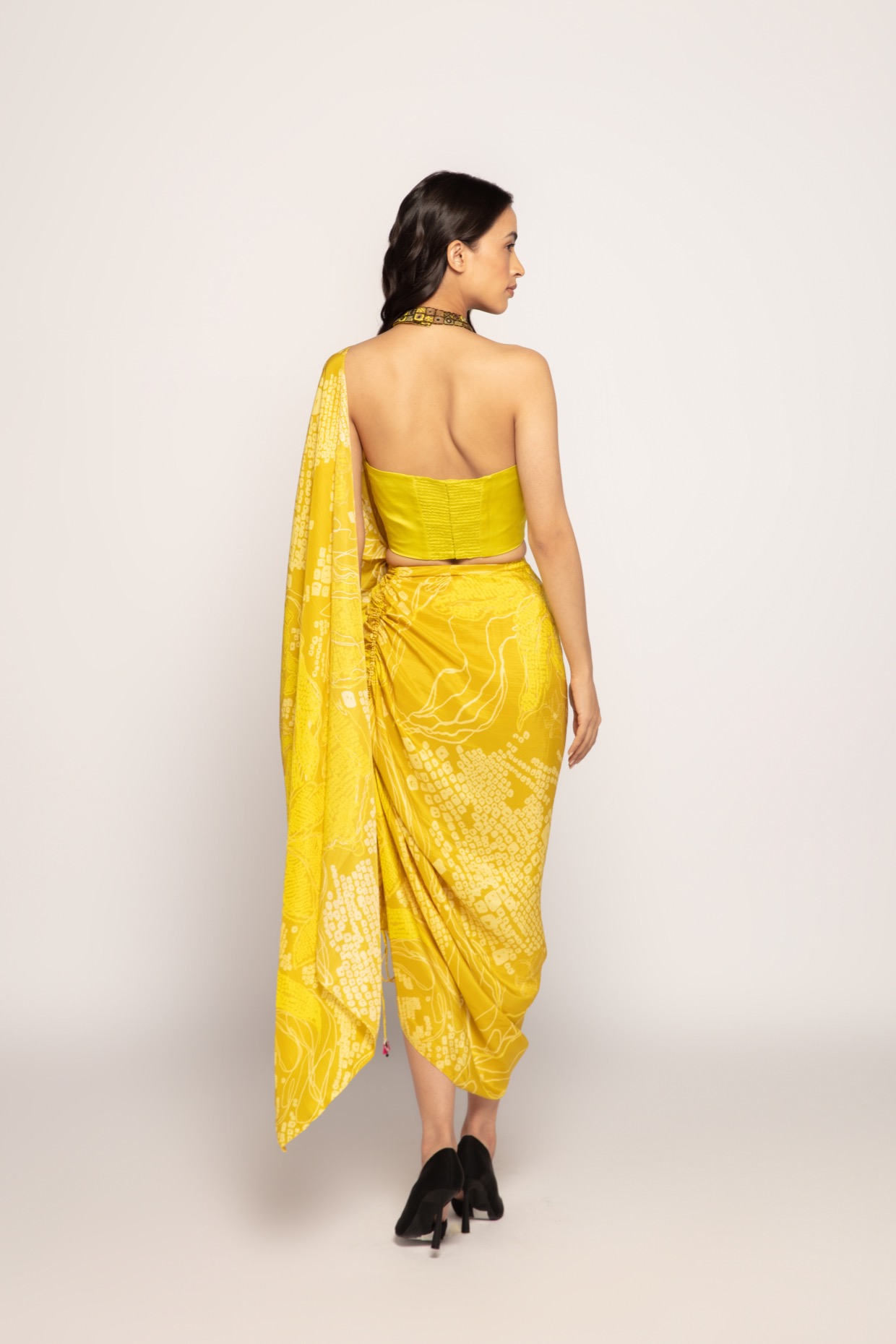 A model showcasing Bandhani Print Drape Saree by Saaksha And Kinni from Saaksha And Kinni's collection
