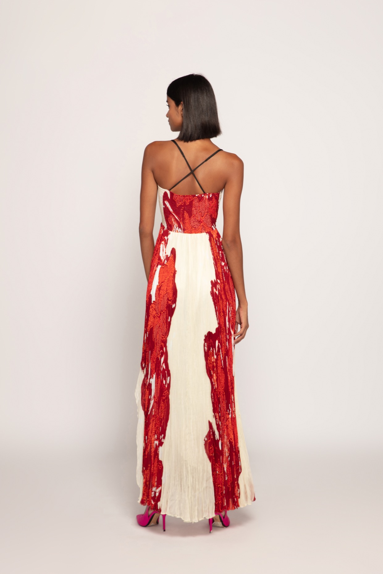 A model showcasing Red Bandhani Print Maxi Dress by Saaksha And Kinni from Saaksha And Kinni's collection