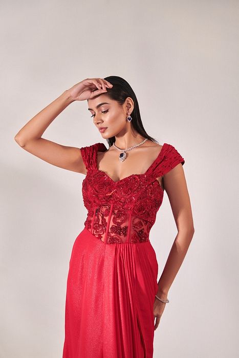 A model showcasing Corset Fitted Gown Drape In Red by One Knot One from One Knot One's collection