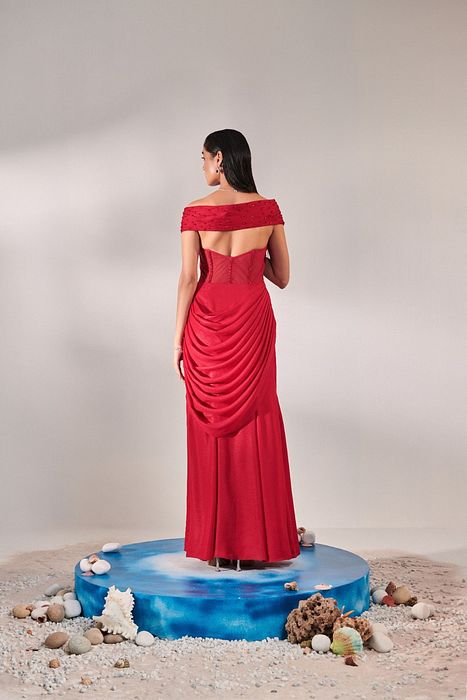 A model showcasing Corset Fitted Gown Drape In Red by One Knot One from One Knot One's collection