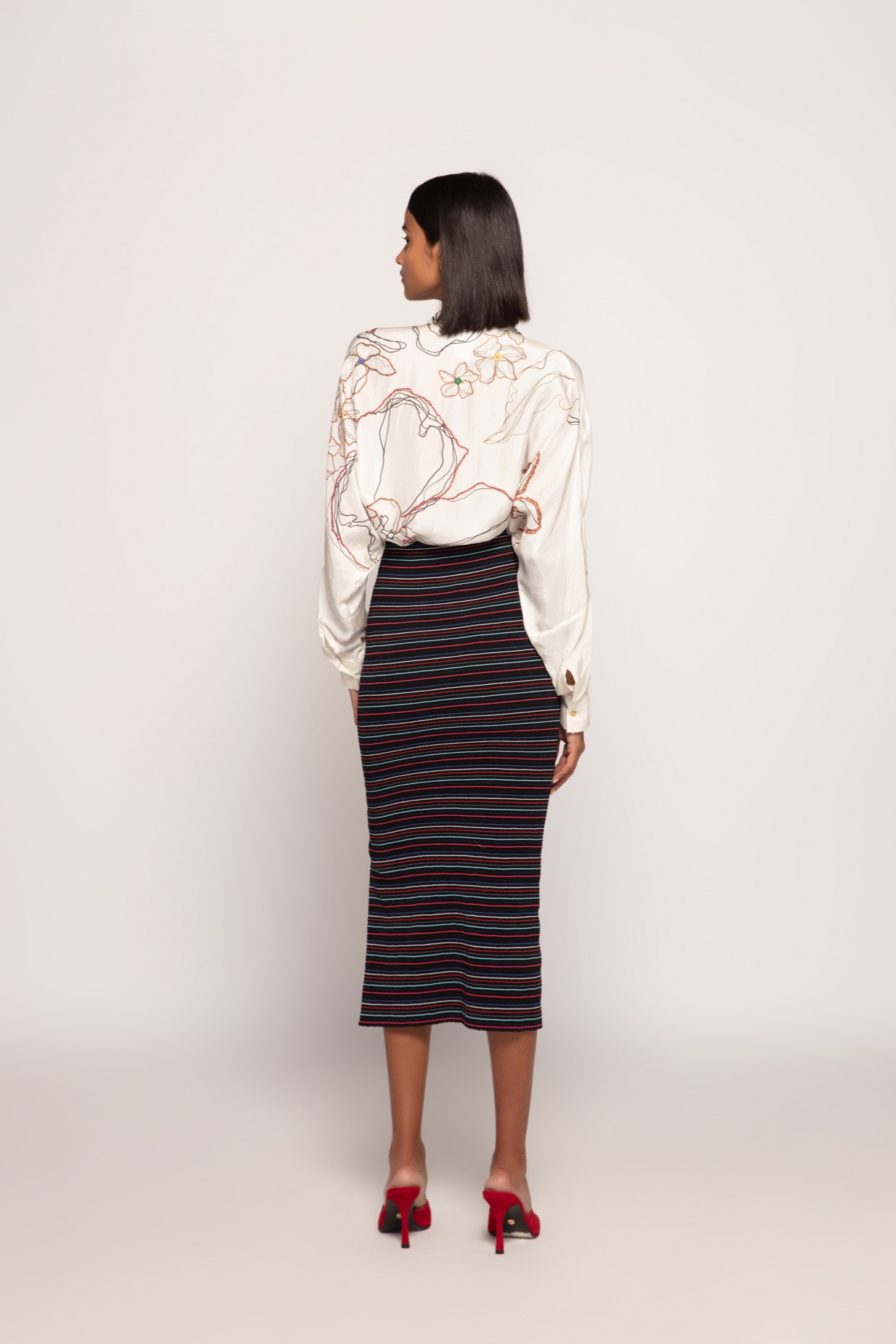 A model showcasing Ivory Periwinkle Print Batwing Shirt by Saaksha And Kinni from Saaksha And Kinni's collection