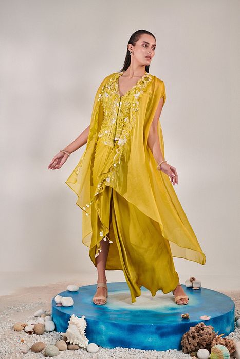 A model showcasing Skirt Set With Cape In Lime Yellow by One Knot One from One Knot One's collection
