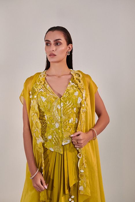 A model showcasing Skirt Set With Cape In Lime Yellow by One Knot One from One Knot One's collection